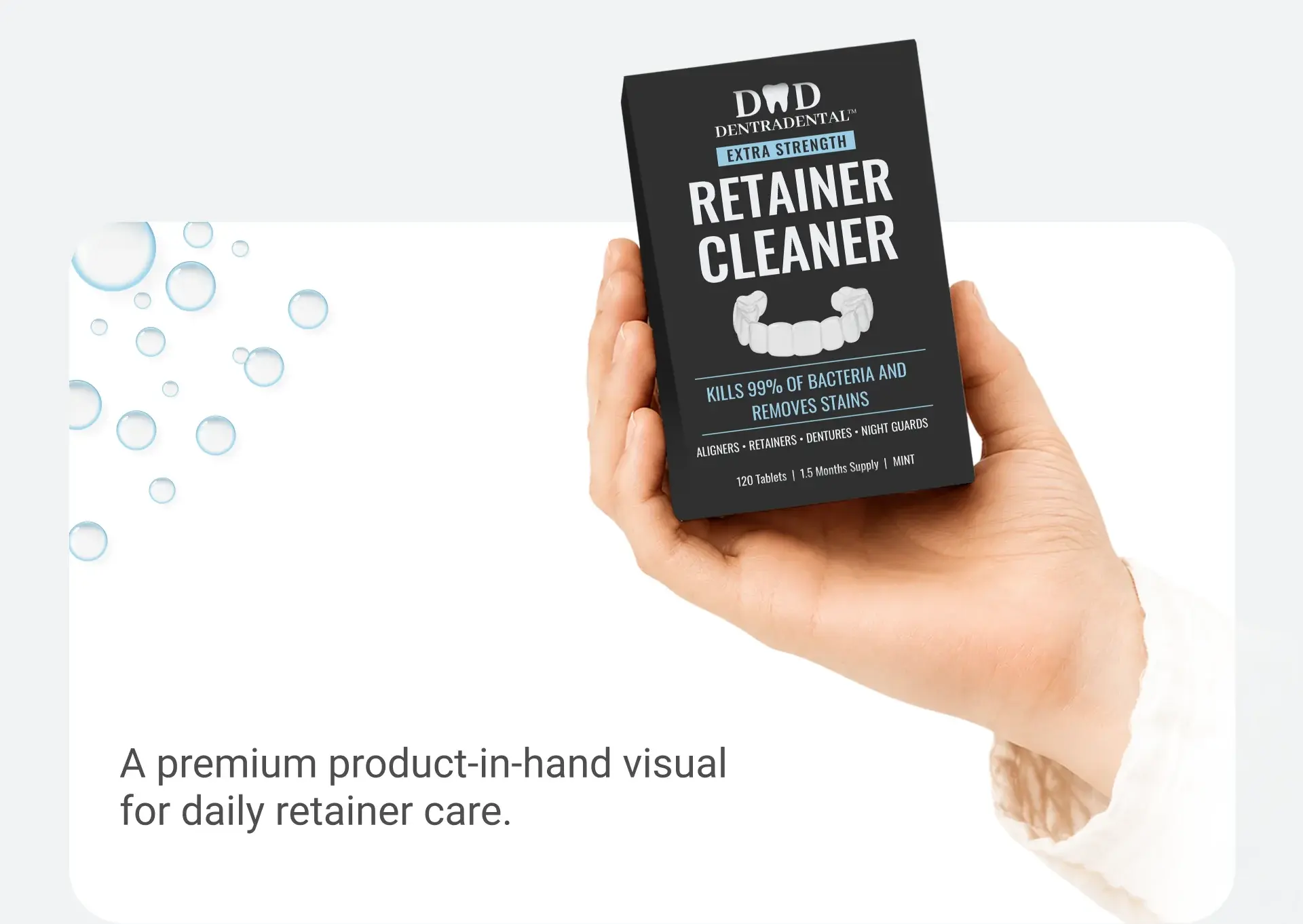 Premium product-in-hand visual of the DentraDental retainer cleaner pack with bubbles