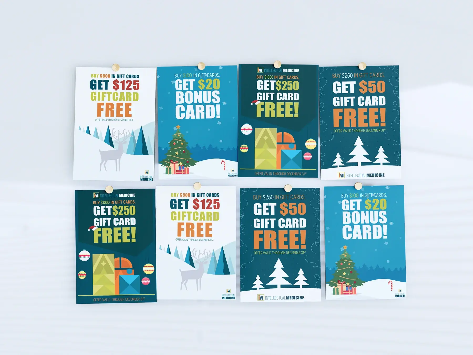 Printed gift card campaign posters laid out together as a collection