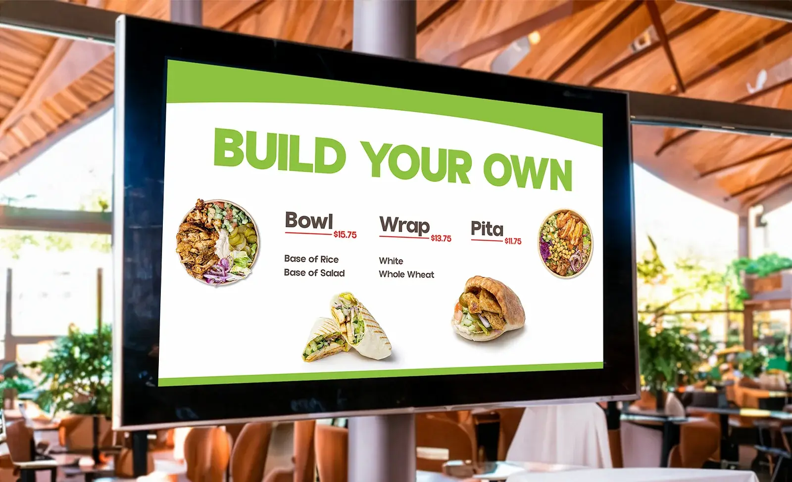 The Build Your Own board on a wall screen: bowl, wrap or pita with rice or salad base, white or whole wheat